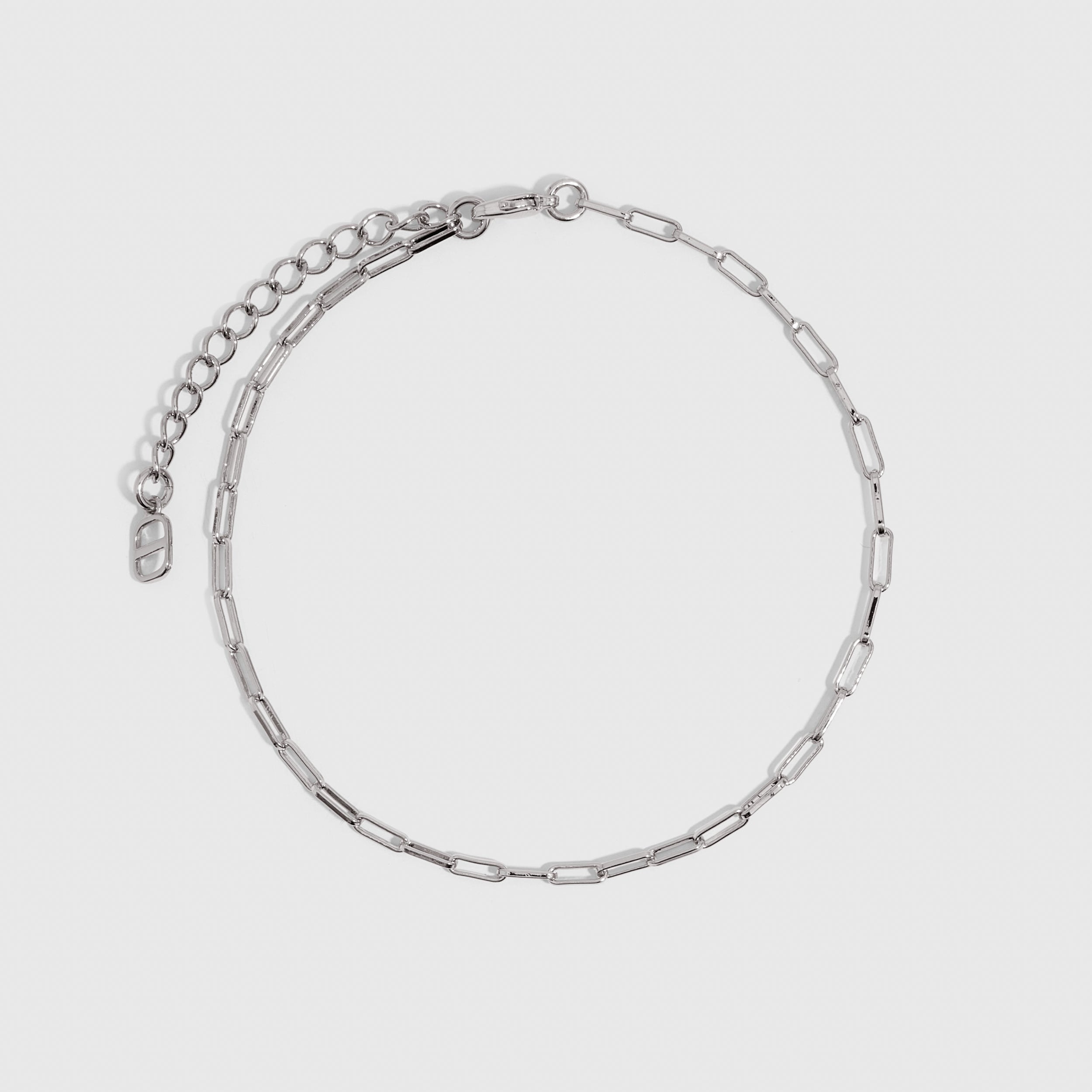 Silver paper clip link chain anklet, shown on a plain background.