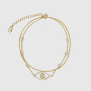 14k gold plated anklet with an evil eye pendant and cubic zirconia pavé detailing, shown on a plain background.