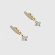 14k gold plated clover motif huggie hoop earrings with cubic zirconia detailing, shown on a plain background.