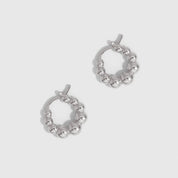 Silver beaded hoop earrings showing small beads strung along the hoop, shown on a plain background.