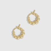 14k gold plated beaded hoop earrings showing small beads strung along the hoop, shown on a plain background.
