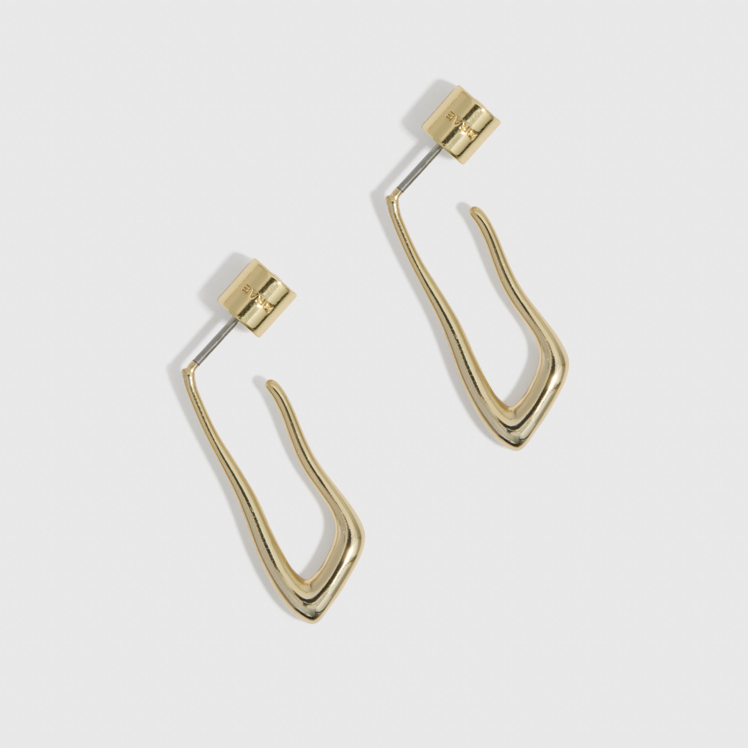 14k gold plated organic-shaped drop hoop earrings shown on a plain background, highlighting their fluid silhouette.
