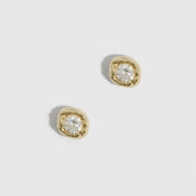 14k gold plated organic stud earrings with a round-cut cubic zirconia in a nugget bezel, shown on a plain background.