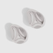 Silver geometric stone earrings with bold architectural lines, shown on a plain background.