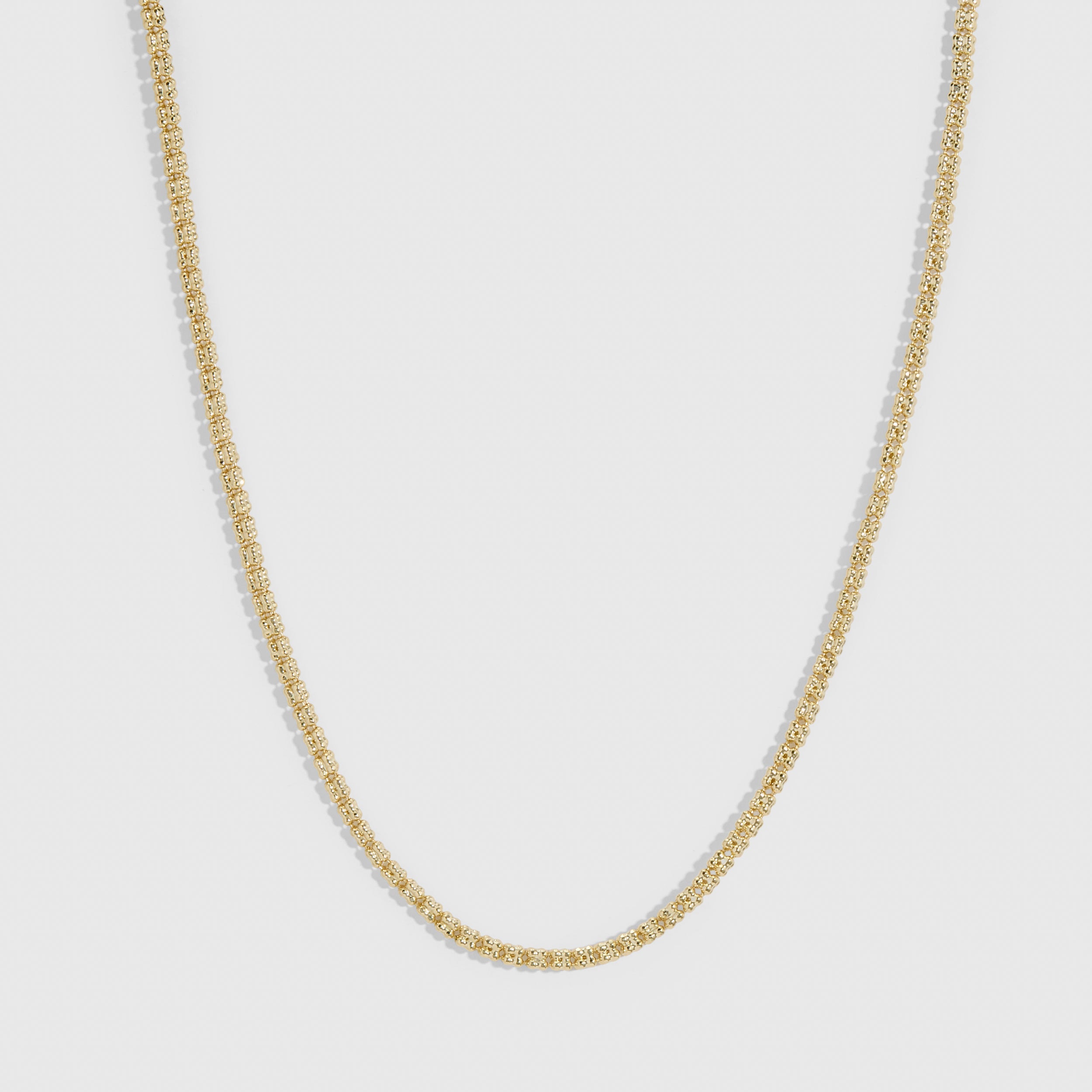 14k gold plated popcorn-link chain necklace showing its twisted, textured profile, shown on a plain background.