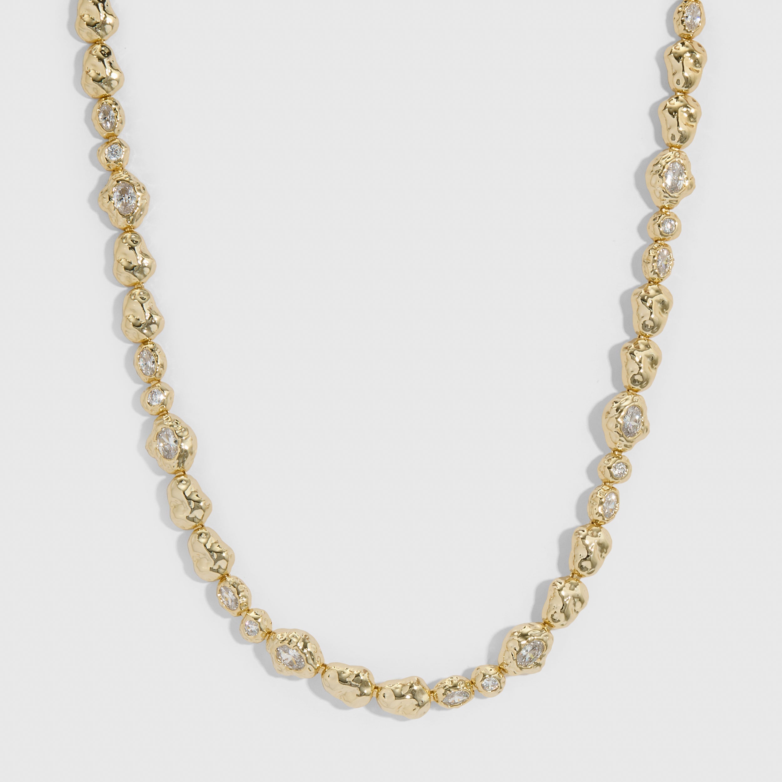 14k gold plated nugget necklace with cubic zirconia nuggets in two sizes on a chain, shown on a plain background.