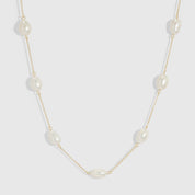 14k gold plated necklace with genuine baroque pearls of varied irregular shapes, shown on a plain background.