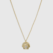 14k gold plated seashell pendant necklace with a teardrop-cut cubic zirconia, shown on a plain background.