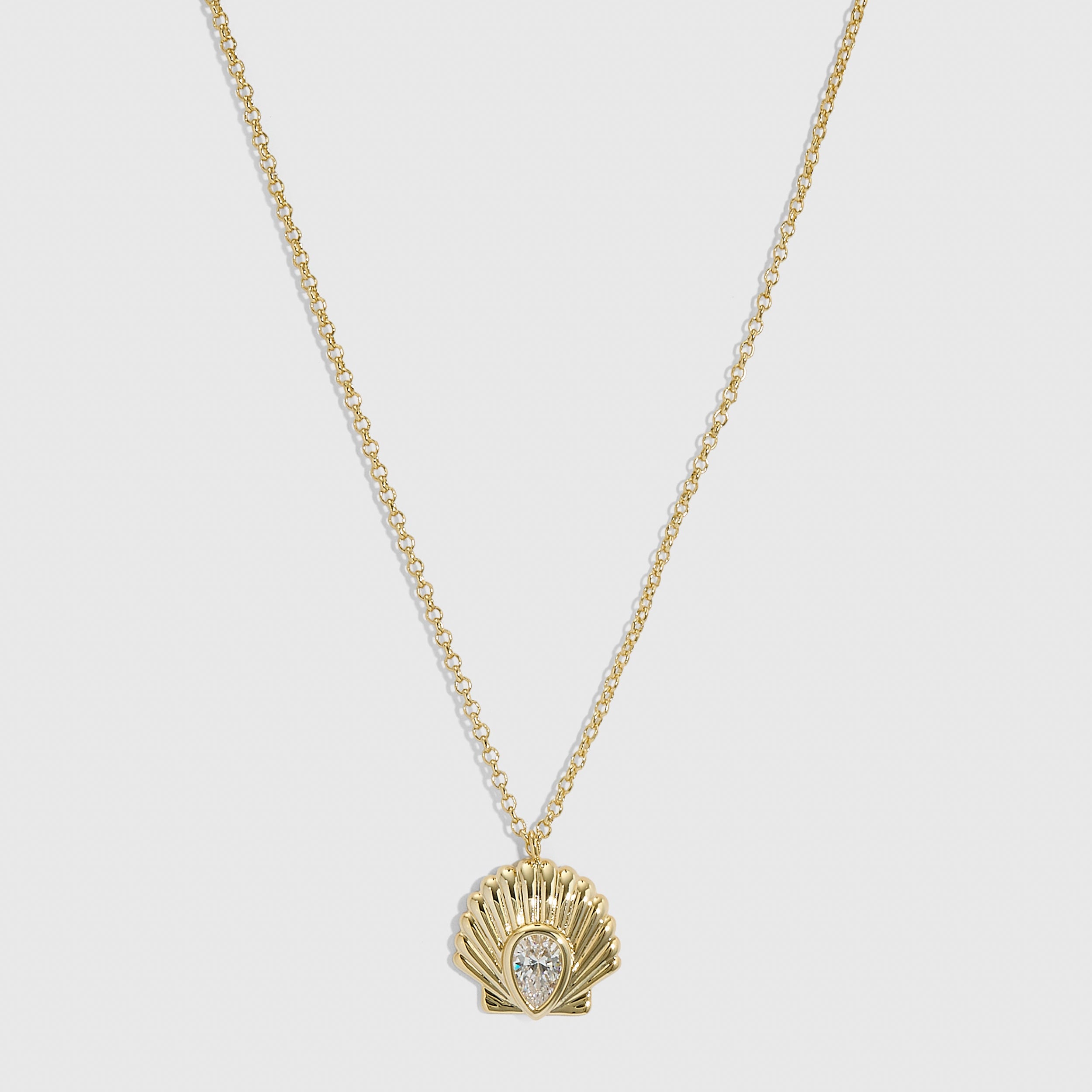 14k gold plated seashell pendant necklace with a teardrop-cut cubic zirconia, shown on a plain background.