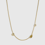 14k gold plated trio pendant necklace with three organic bezels holding mixed cubic zirconia and citrine stones, shown on a plain background.