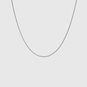 Silver flat curb chain necklace, shown on a plain background.