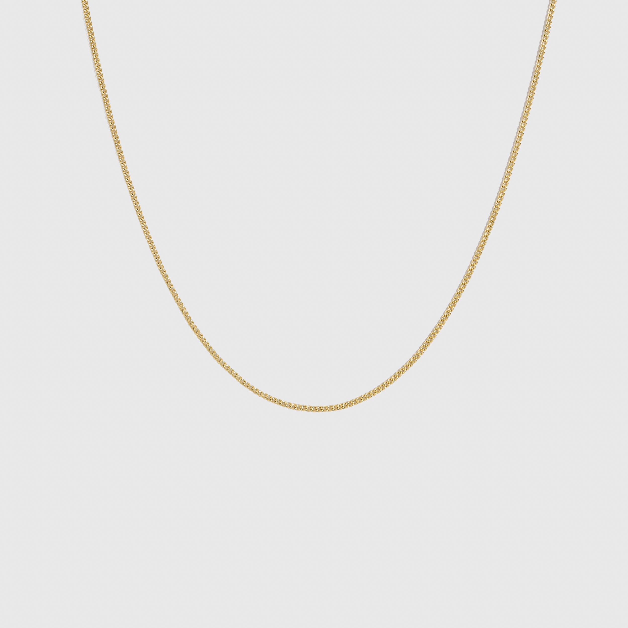 14k gold plated flat curb chain necklace, shown on a plain background.