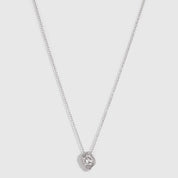 Silver solitaire nugget pendant necklace with bezel-set cubic zirconia, shown on a plain background.