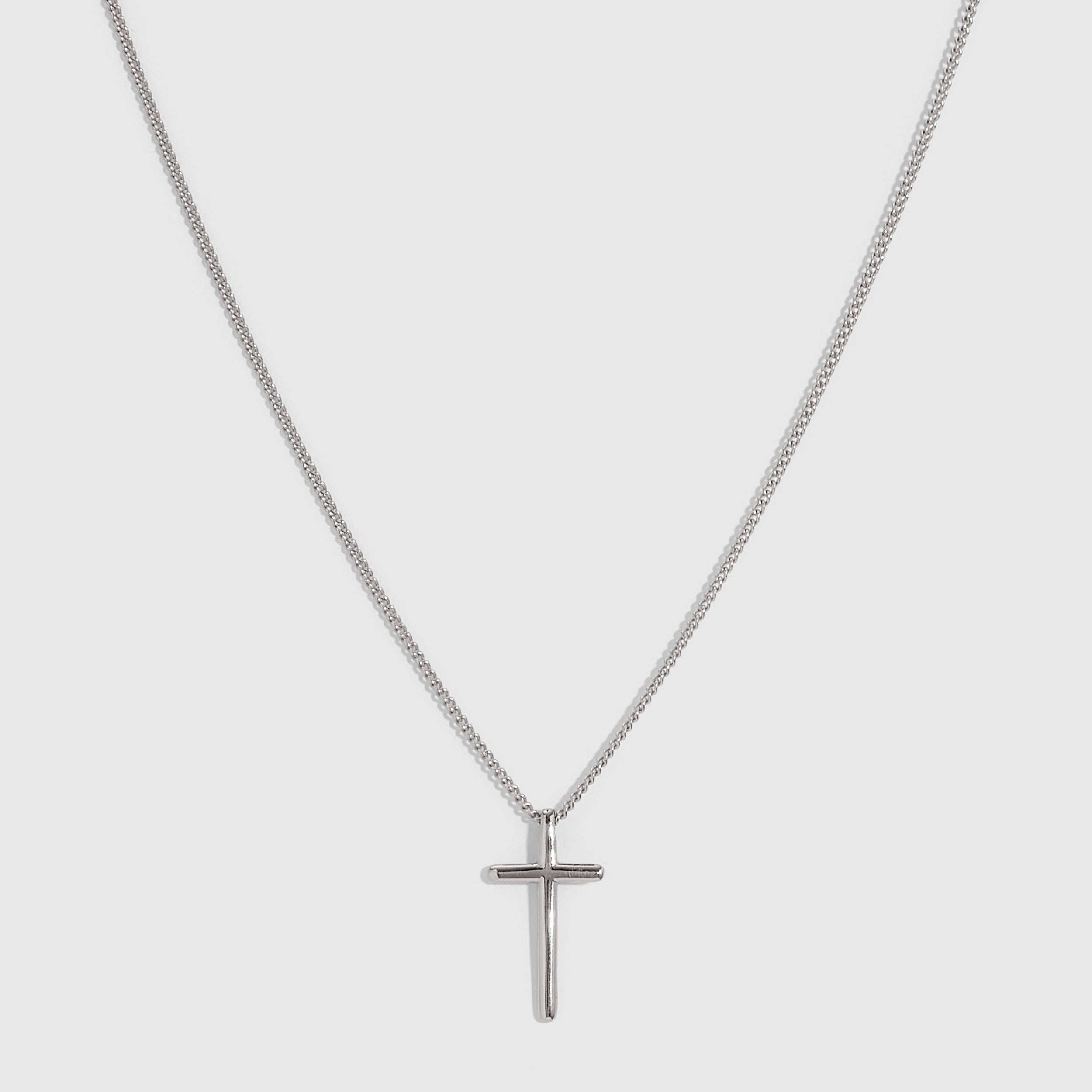 Silver cross pendant necklace with a plain 20mm cross on a flat curb chain, shown on a plain background.