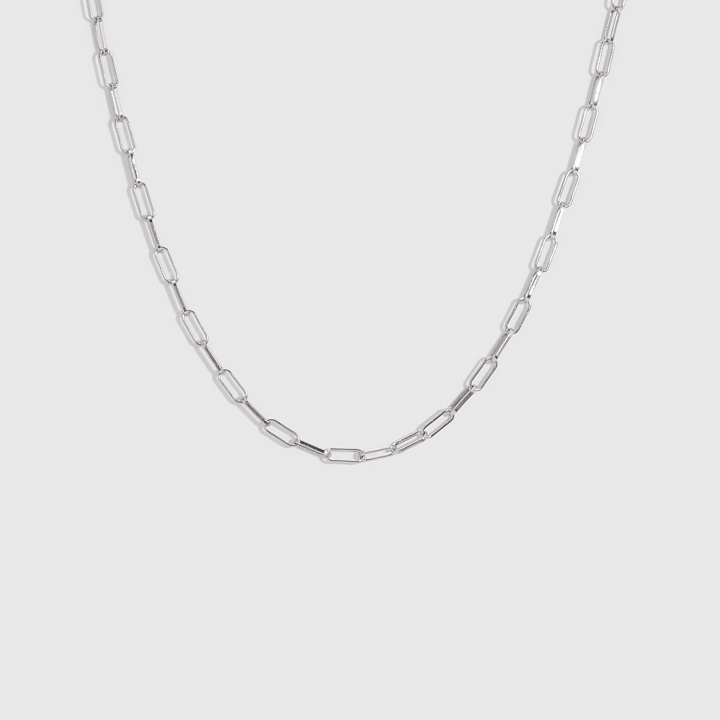 Silver paper clip link chain necklace, shown on a plain background.