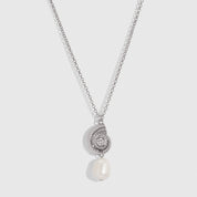 Silver seashell pendant necklace cradling a genuine freshwater pearl, shown on a plain background.