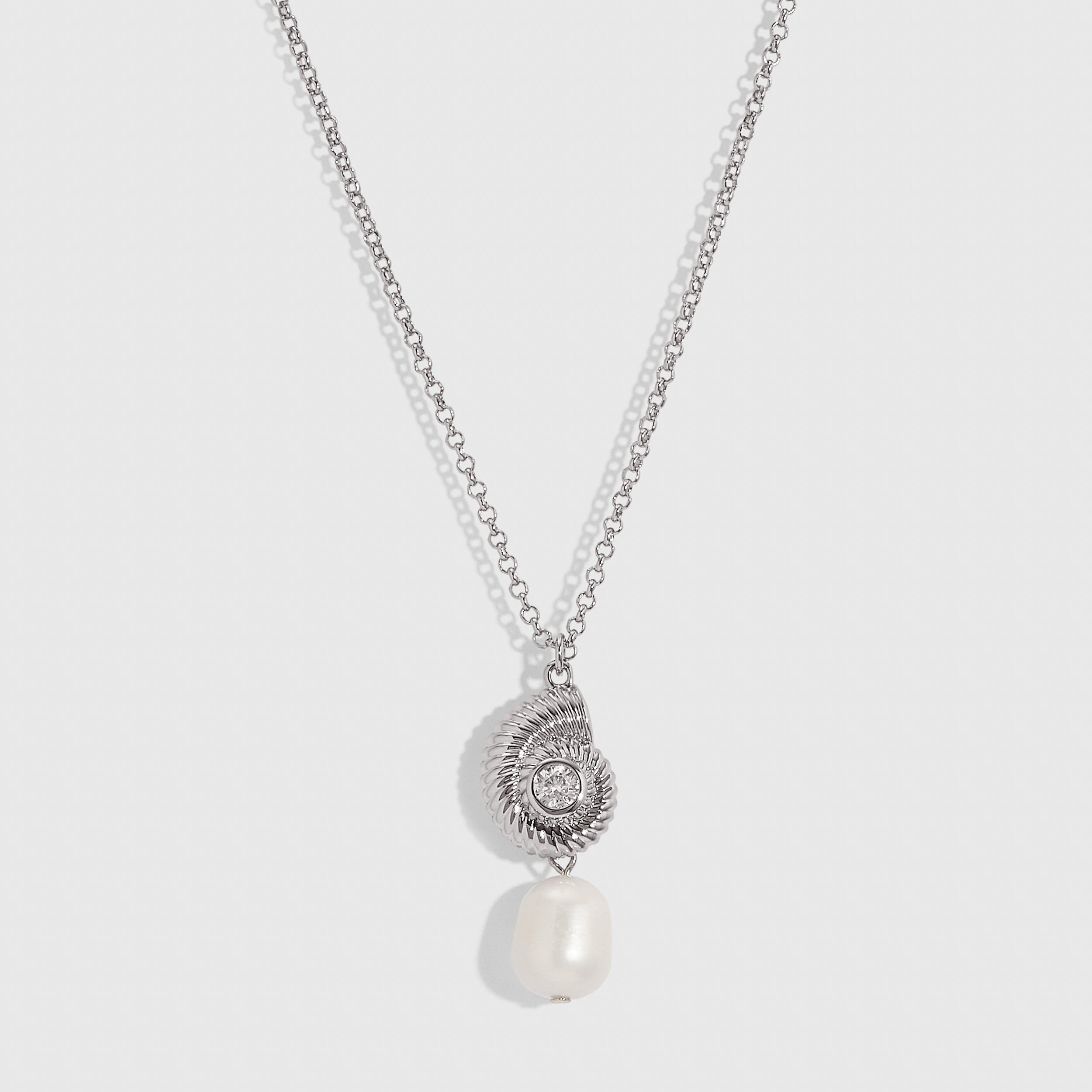 Silver seashell pendant necklace cradling a genuine freshwater pearl, shown on a plain background.