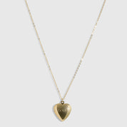 14k gold plated puffy heart locket pendant necklace engraved with the word LOVE, shown open and closed on a plain background.