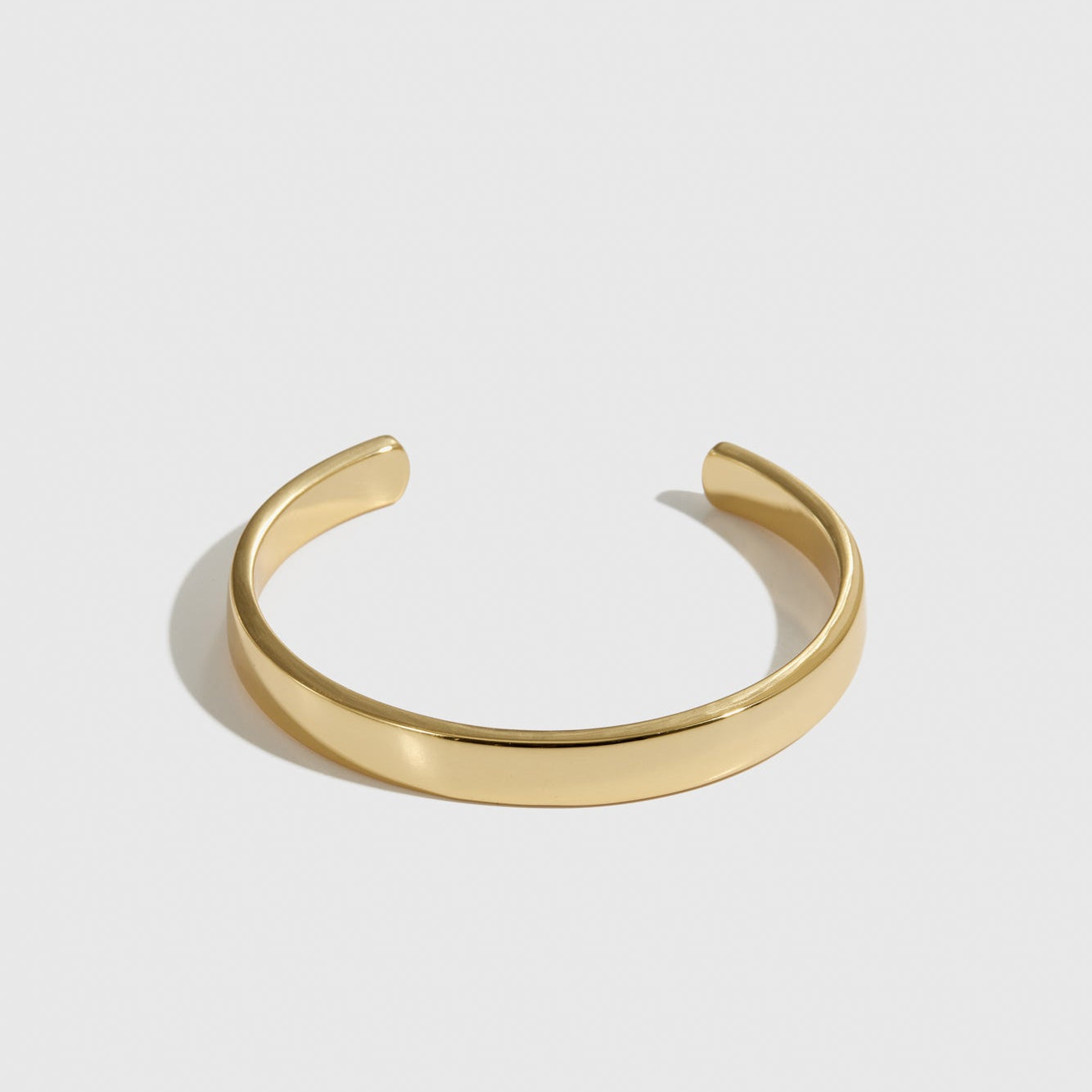 14k gold plated men's cuff bracelet, shown on a plain background.
