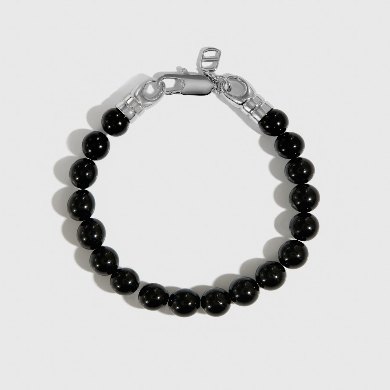 Silver plated men's black agate bead bracelet, shown on a plain background.
