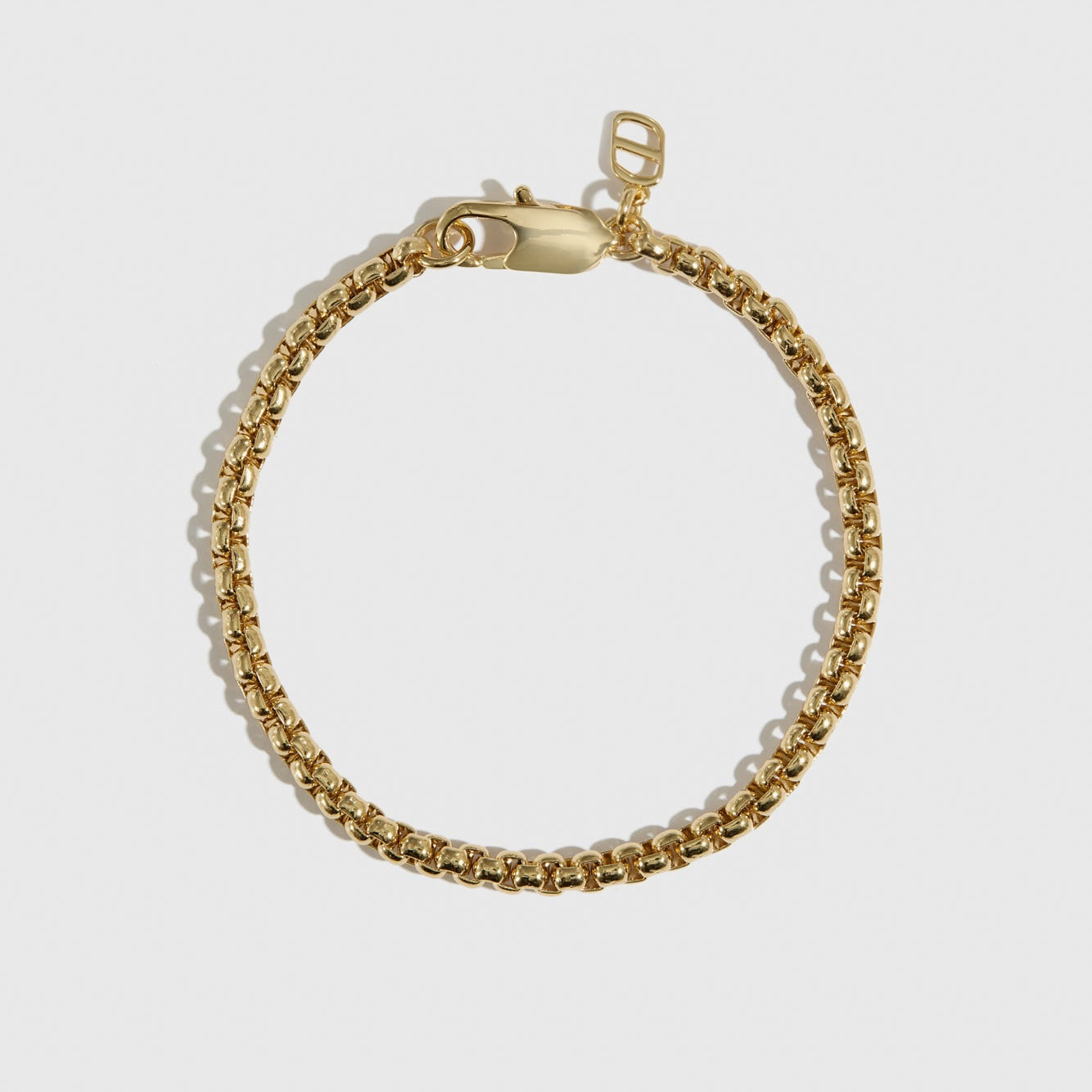 14k gold plated men's round box chain bracelet, shown on a plain background.