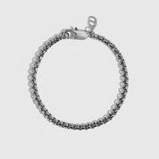 Silver plated men's round box chain bracelet, shown on a plain background.