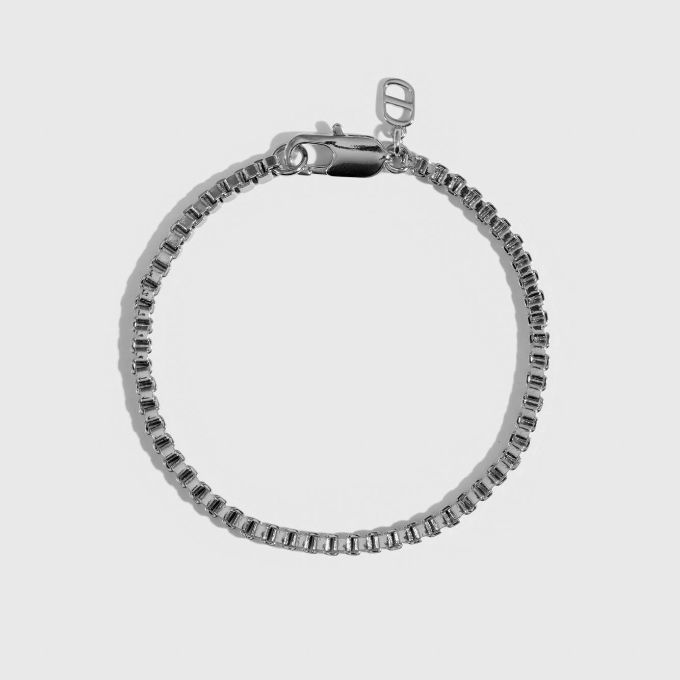 Silver plated men's box chain bracelet, shown on a plain background.