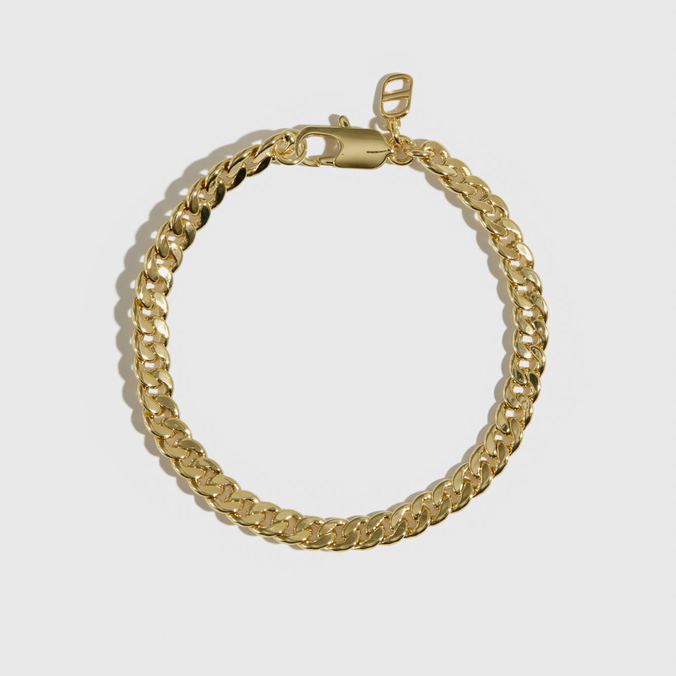 14k gold plated men's curb chain bracelet, shown on a plain background.