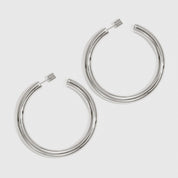 Silver plated medium hollow hoop earrings, shown on a plain background.