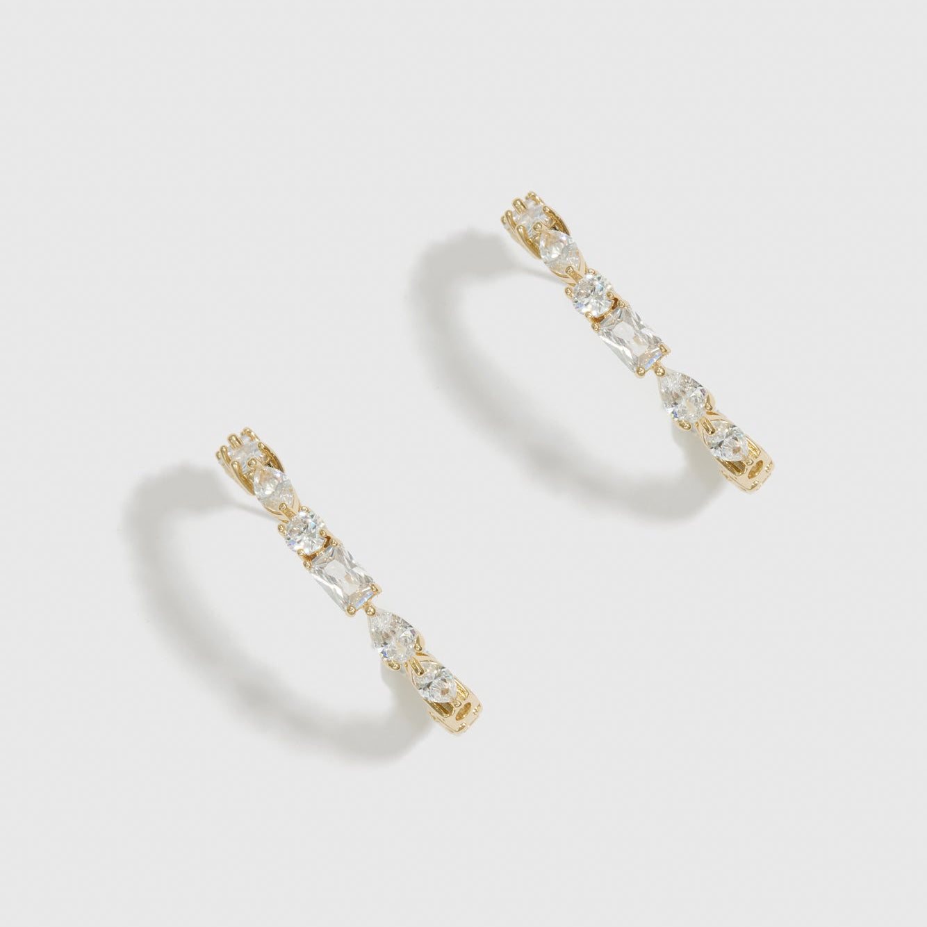 14k gold plated multi-cut hoop earrings with cubic zirconia, shown on a plain background.