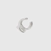 Sterling silver 925 teardrop-cut solitaire ear cuff with a cubic zirconia, shown on a plain background.