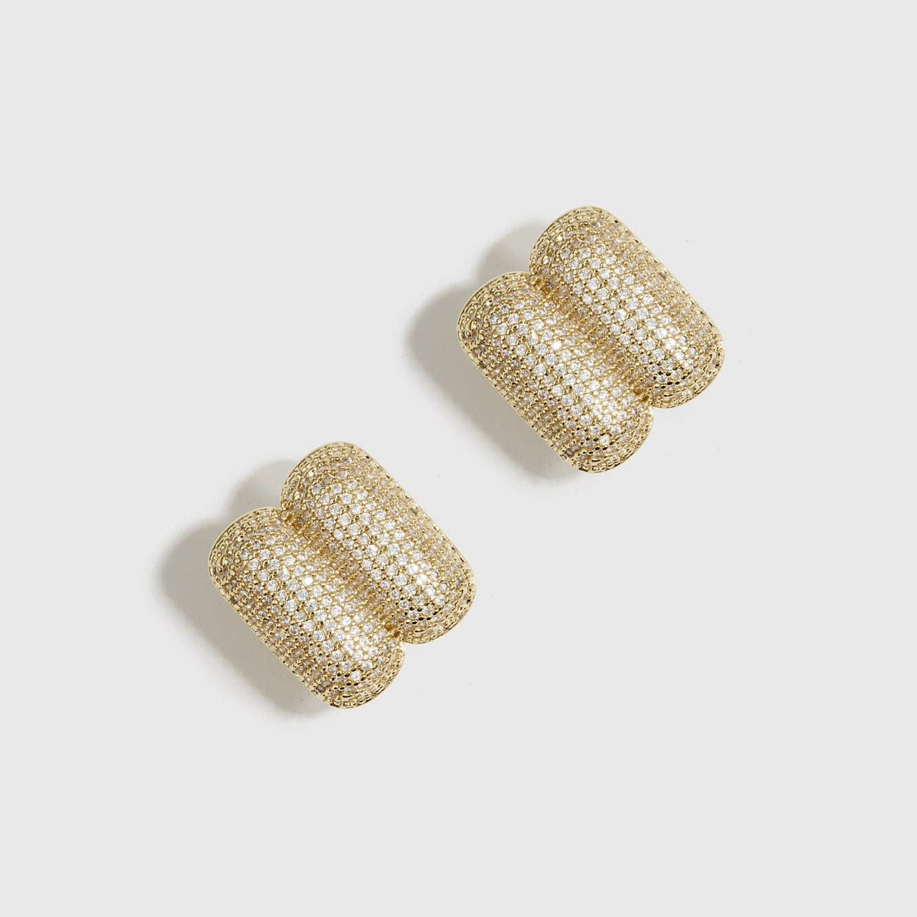 14k gold plated double rounded rectangle pavé stud earrings with cubic zirconia pavé, shown on a plain background.