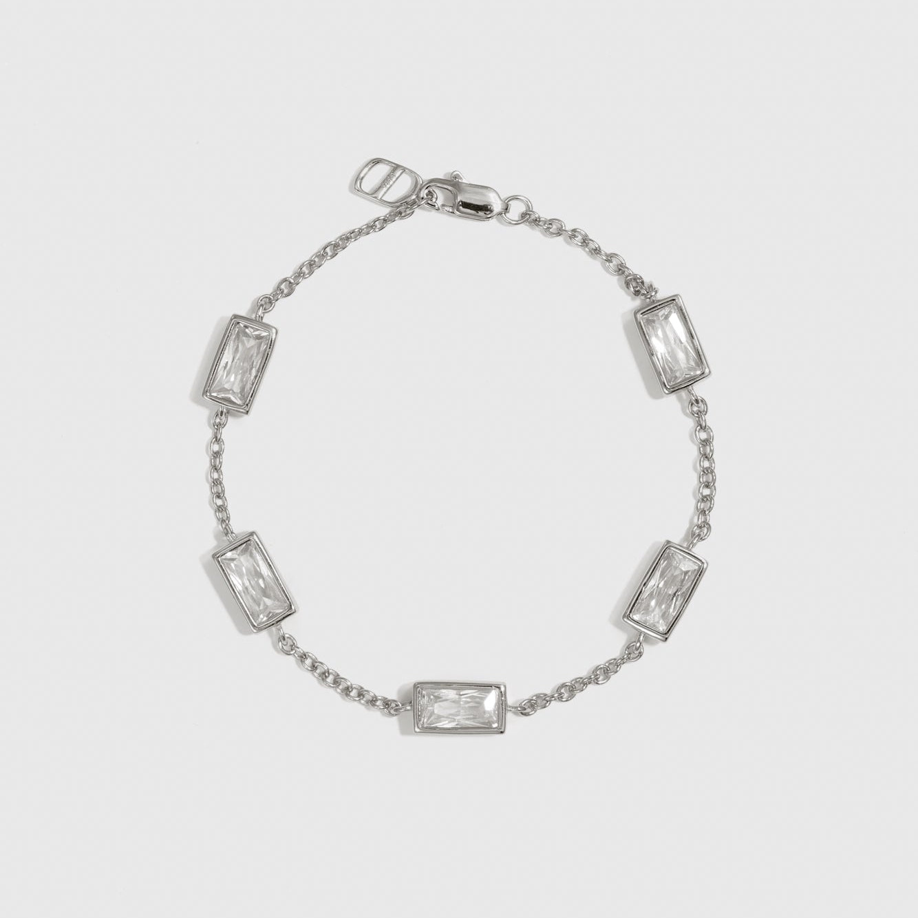 Sterling silver 925 baguette-cut multi bezel bracelet with cubic zirconia, shown on a plain background.