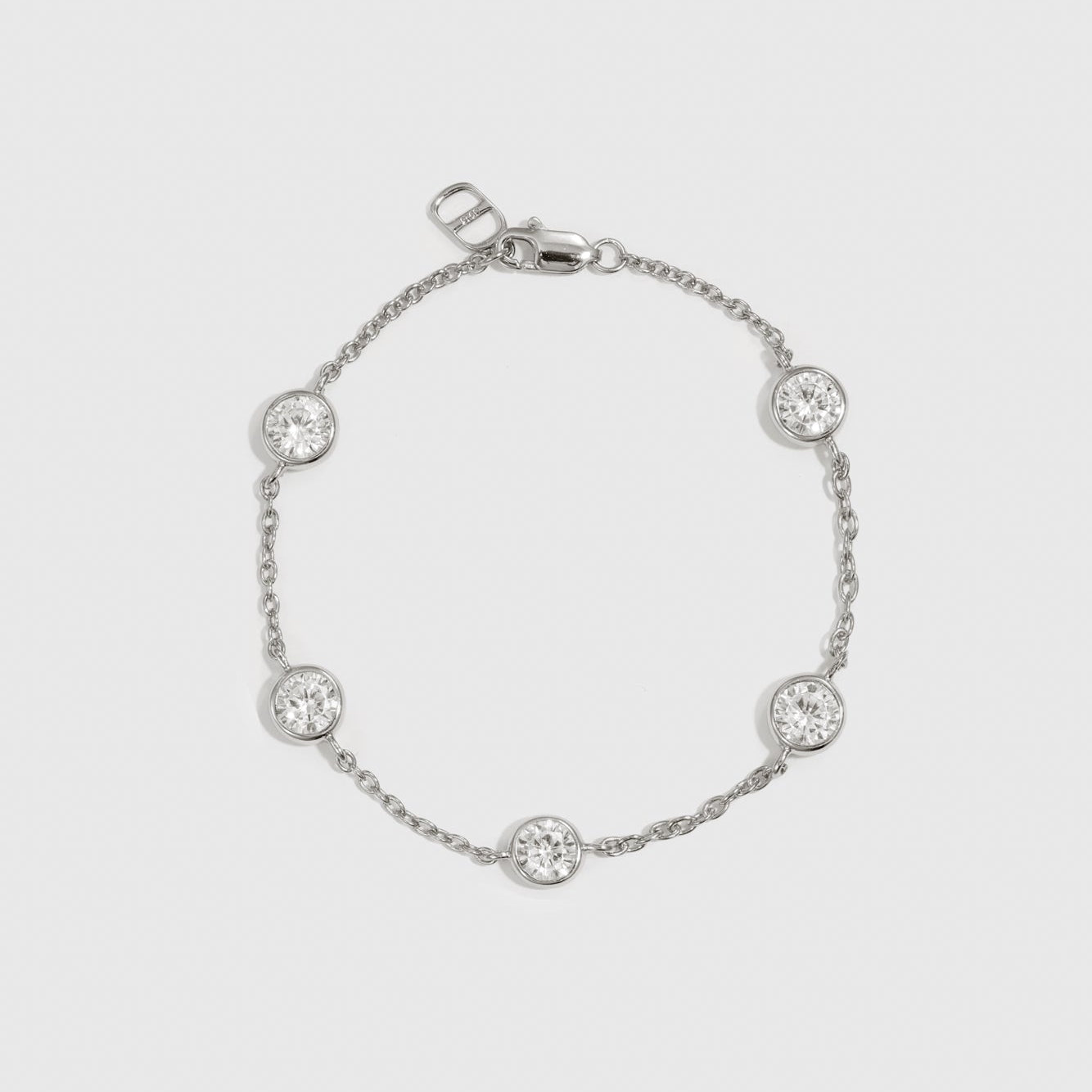 Sterling silver 925 round-cut multi bezel bracelet with cubic zirconia, shown on a plain background.
