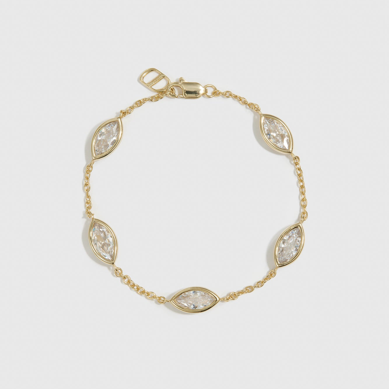 14k gold plated sterling silver 925 marquise-cut multi bezel bracelet with cubic zirconia, shown on a plain background.