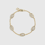 14k gold plated sterling silver 925 marquise-cut multi bezel bracelet with cubic zirconia, shown on a plain background.