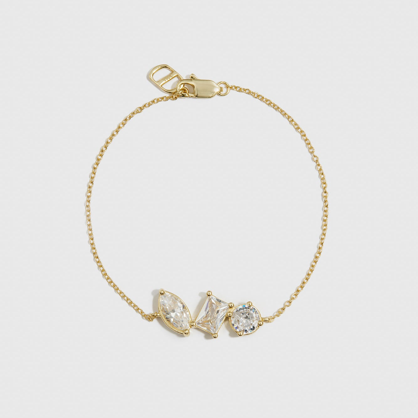 14k gold plated sterling silver 925 trio-cut dainty bracelet with cubic zirconia, shown on a plain background.