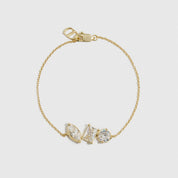 14k gold plated sterling silver 925 trio-cut dainty bracelet with cubic zirconia, shown on a plain background.