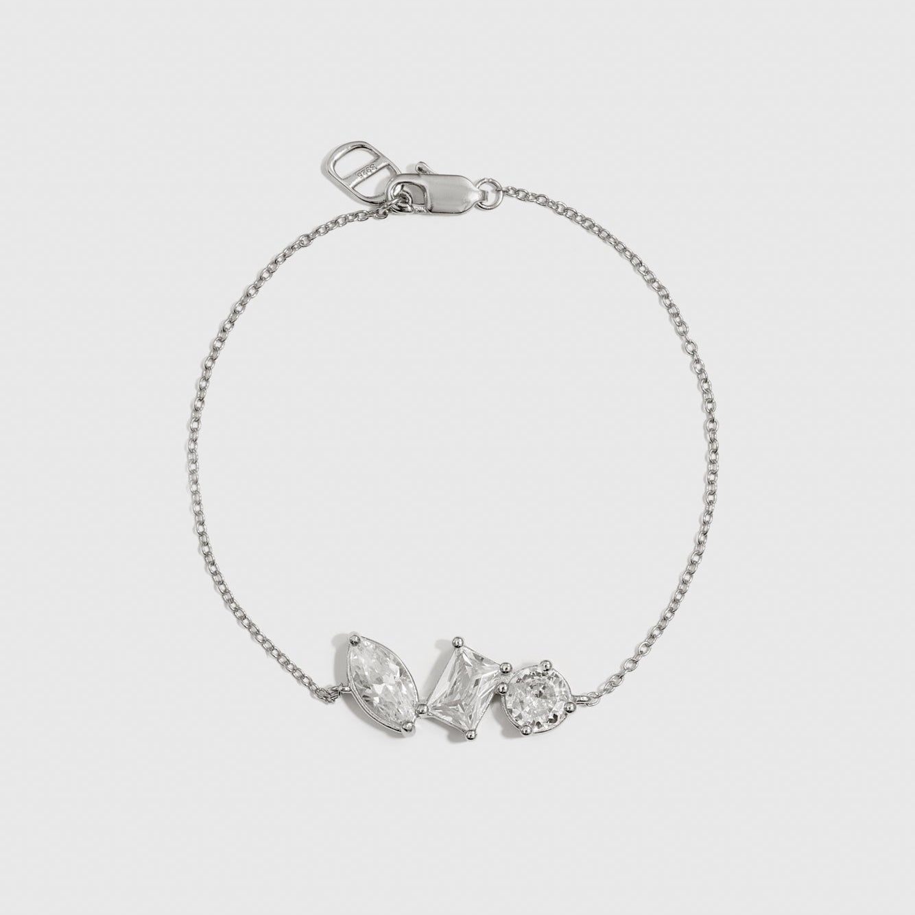 Sterling silver 925 trio-cut dainty bracelet with cubic zirconia, shown on a plain background.