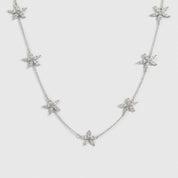 Sterling silver 925 flower multi necklace with cubic zirconia flowers, shown on a plain background.