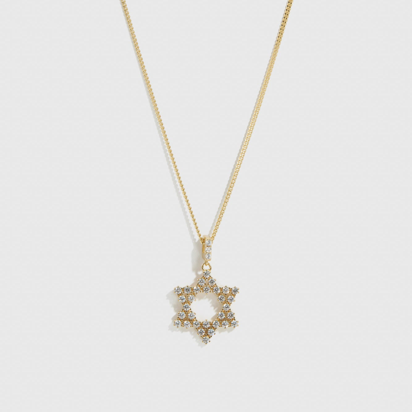 14k gold plated sterling silver 925 Star of David pendant necklace with cubic zirconia, shown on a plain background.