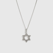 Silver Star of David pendant necklace with cubic zirconia, shown on a plain background.