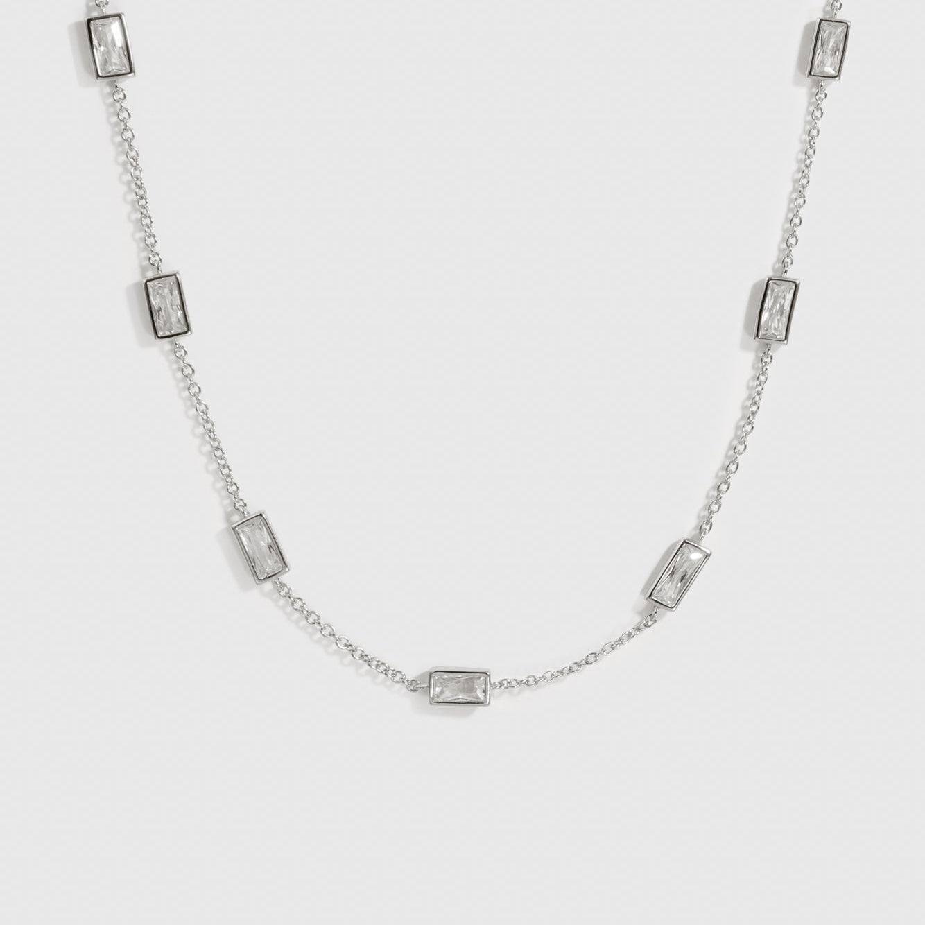 Sterling silver 925 baguette-cut multi bezel necklace with cubic zirconia, shown on a plain background.