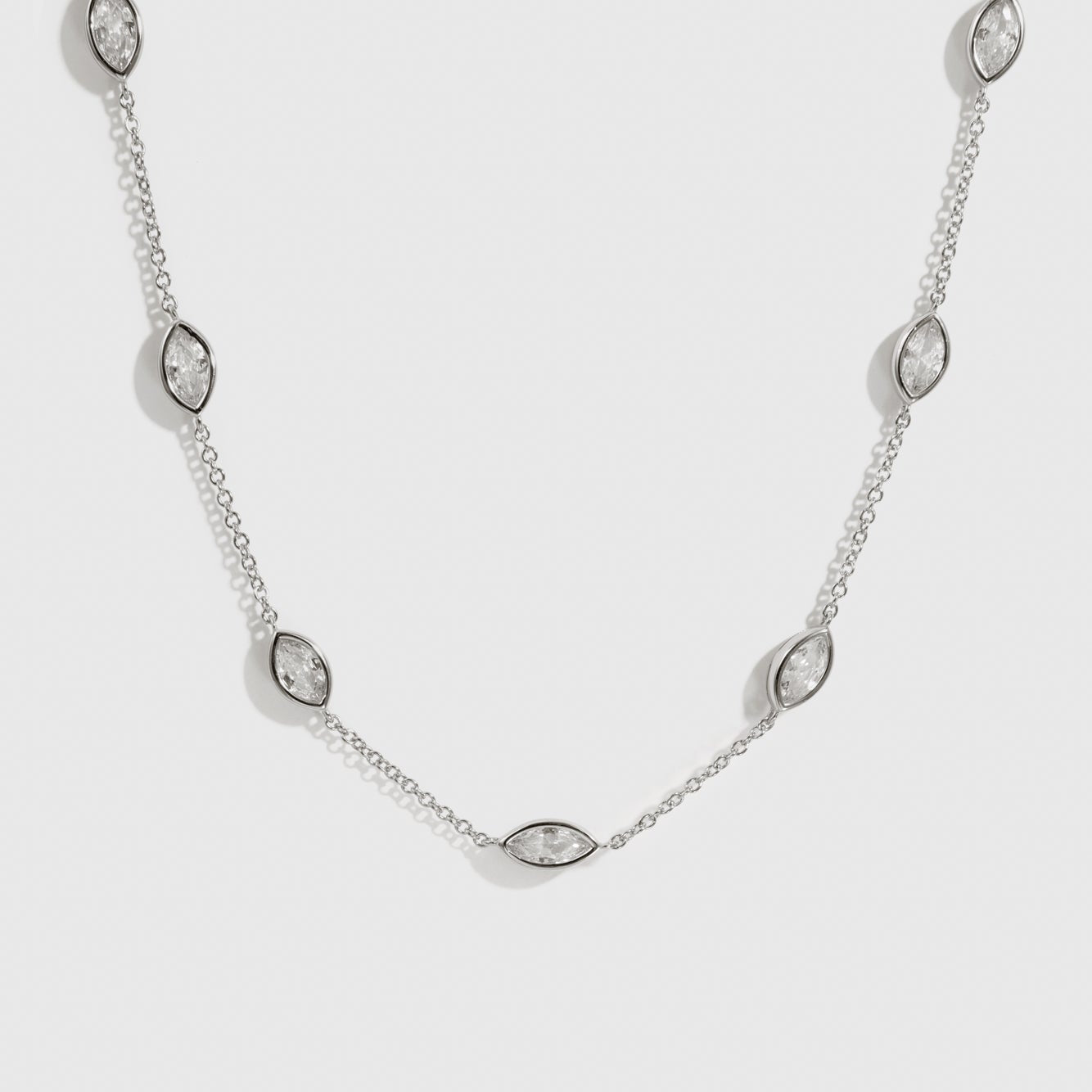Sterling silver 925 marquise-cut multi bezel necklace with cubic zirconia, shown on a plain background.