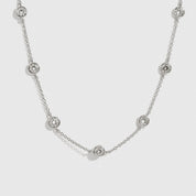 Sterling silver 925 round-cut multi bezel necklace with cubic zirconia, shown on a plain background.