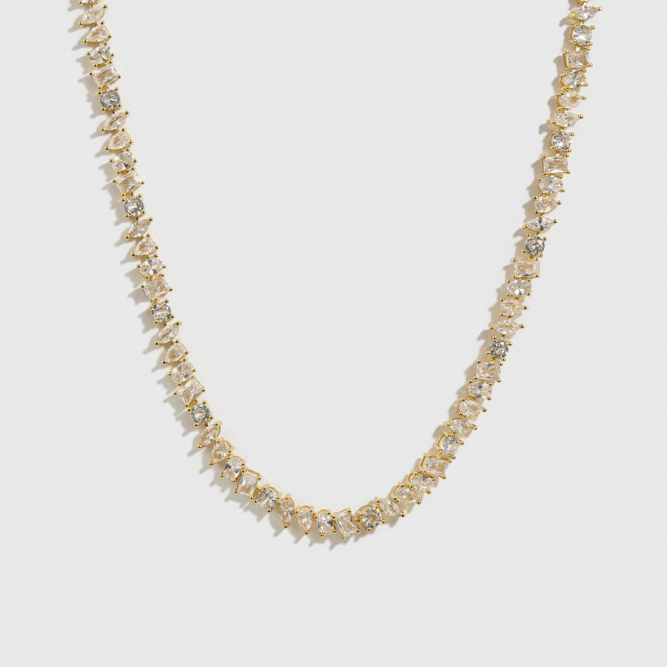 14k gold plated multi-cut tennis necklace with cubic zirconia, shown on a plain background.