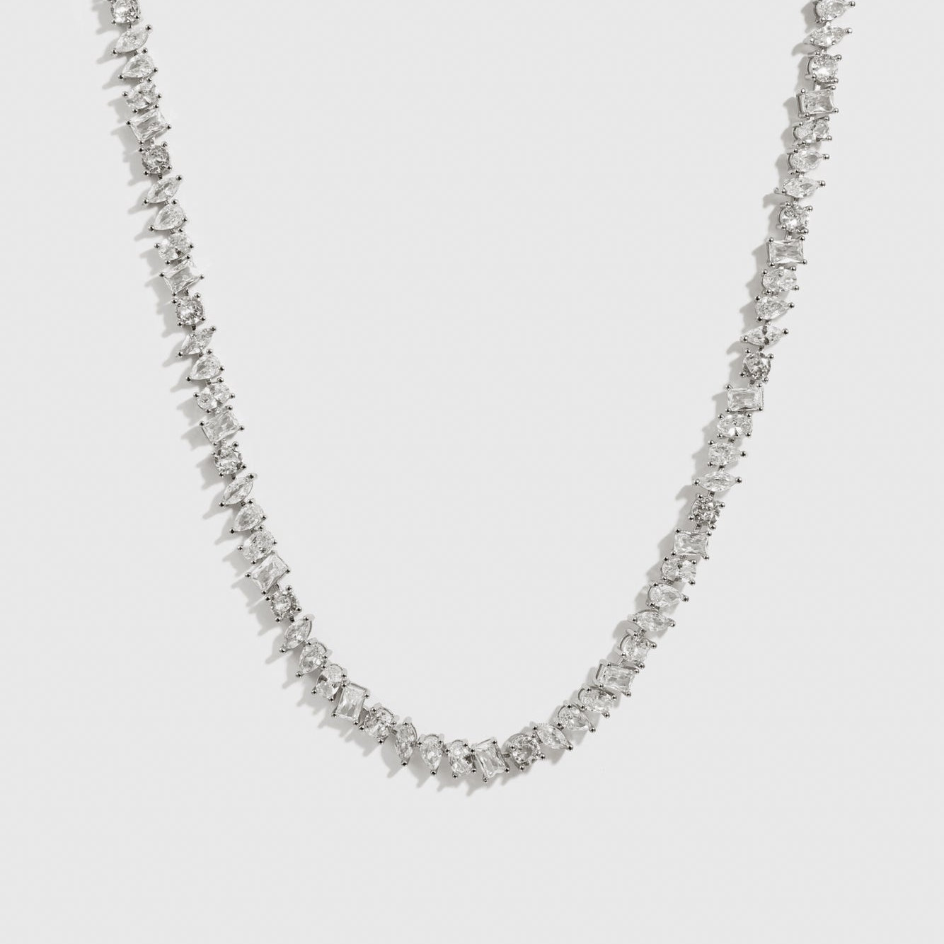Silver plated multi-cut tennis necklace with cubic zirconia, shown on a plain background.