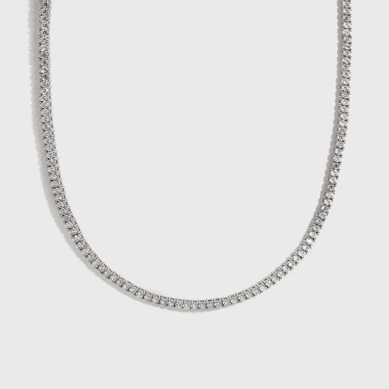 Silver plated dainty tennis choker with cubic zirconia, shown on a plain background.