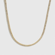14k gold plated dainty tennis necklace with cubic zirconia, shown on a plain background.