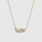 14k gold plated sterling silver 925 trio-cut dainty necklace with cubic zirconia, shown on a plain background.
